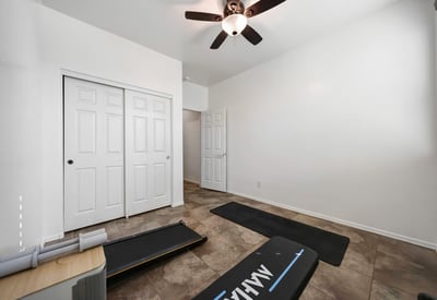 Bedroom closet featuring built-in shelving and hanging rods, maximizing storage and organization.
