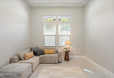Adaptable flex room with tile floors and neutral tones, easily suited for a home office, workout room, or creative studio.
