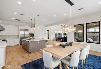 Great room featuring large sliding doors that open to the patio, blending indoor and outdoor living. Ideal for enjoying Scottsdale s climate and entertaining guests.