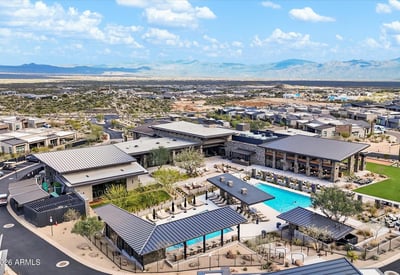 Bird s-eye view of the community amenities featuring resort-style pools, shaded seating areas, and contemporary Scottsdale design elements.