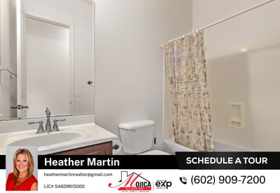 This clean and functional guest bathroom includes a full tub and shower, extended vanity, and wood cabinetry. A practical addition to this well-maintained Glendale home for sale.