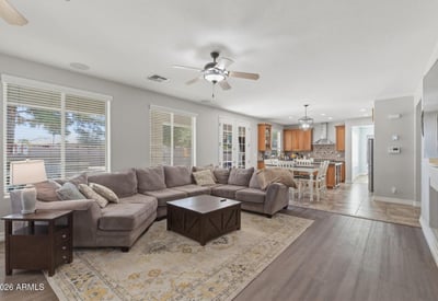 Expansive great room that flows into the kitchen and dining areas, highlighting the open floor plan that makes this Queen Creek home perfect for modern living.