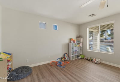 Spacious bonus room with wood-style flooring and natural light, offering flexible space for a playroom, office, or additional living area.