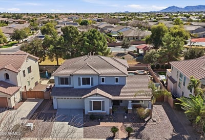 Aerial photo highlighting the full property footprint, landscaped yard, and surrounding neighborhood streets in this desirable Queen Creek location.