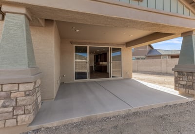 Covered patio designed for comfort and shade, perfect for outdoor seating, grilling, or relaxing evenings.