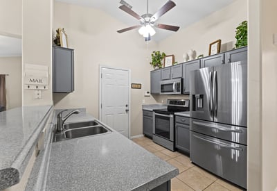 Well-designed kitchen with ample cabinetry, clean finishes, and natural light. Perfect for daily use and entertaining.