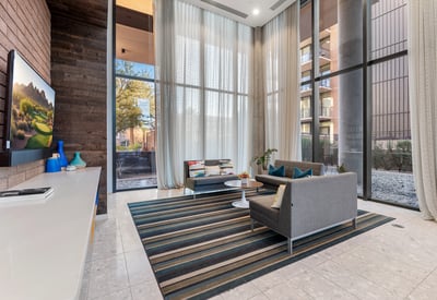 Dedicated media space with contemporary seating and large windows, ideal for entertainment and leisure in Phoenix.
