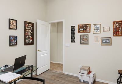 Multi-purpose room perfect for a home office, study, or guest bedroom, featuring updated flooring and modern appeal in Phoenix.