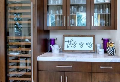 Custom cabinetry with integrated wine storage and display, blending sophistication and practicality in this upgraded Phoenix residence.