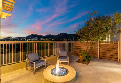 Private patio with modern fire feature and comfortable seating, offering breathtaking Scottsdale mountain views and peaceful outdoor ambiance.
