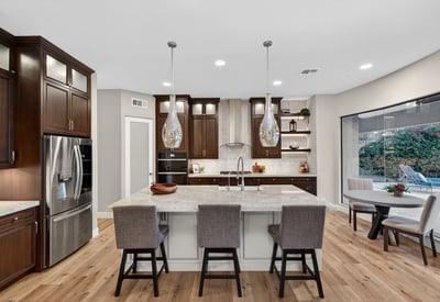 Light-filled kitchen with modern finishes, large island, and open layout connecting seamlessly to the Scottsdale living space.