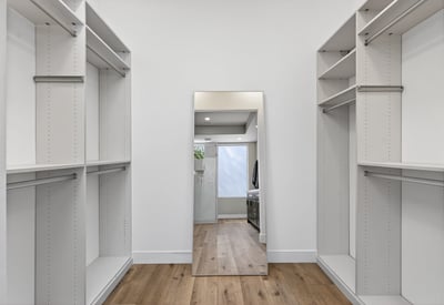 Spacious Scottsdale closet with custom built-ins, shelving, and hanging space designed for organization and storage.