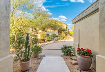 Scottsdale entry path with desert plants, stone accents, and low-maintenance landscaping leading to the front entrance.