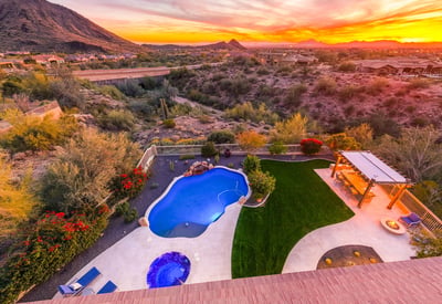 Scottsdale aerial view featuring the backyard pool, pergola kitchen, and open desert space, enhancing privacy and lifestyle appeal.