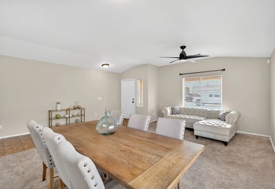 Flexible dining and living area with neutral tones and natural light. Open-concept layout enhances everyday living and entertaining in this Casa Grande home.
