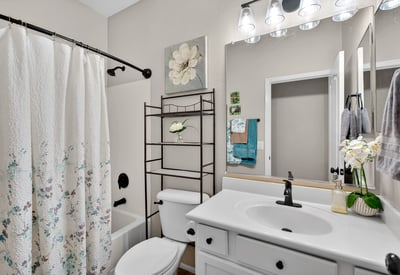 Full bathroom featuring a tub and shower combo with clean finishes. Designed for functionality and ease in Casa Grande.