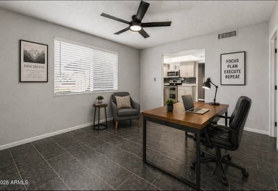 Staged workspace highlighting flexibility and modern design. This Sun City home offers updated interiors ideal for remote work or creative space.