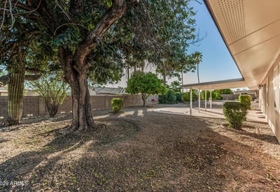 Generous backyard with covered patio and established landscaping. This Sun City home highlights comfortable outdoor living and entertaining potential.