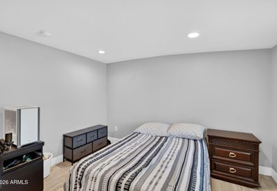 Comfortable guest bedroom with clean finishes, modern flooring, and flexible layout options.