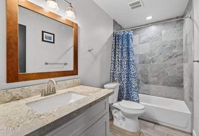 Functional full bathroom with tub-shower combo, updated tile, and clean finishes.