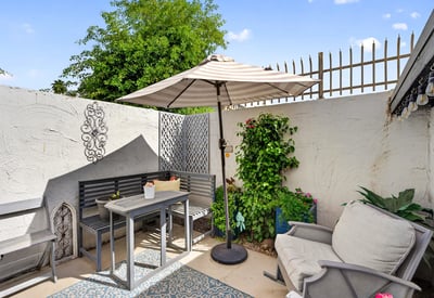 Scottsdale outdoor space featuring dining table, decorative elements, and lush plants for an inviting entertaining area.