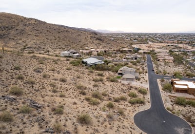 Wide panoramic aerial view capturing stunning desert landscapes, valley scenery, and hillside surroundings. This luxury Phoenix homesite offers privacy, views, and custom home potential in a scenic setting.