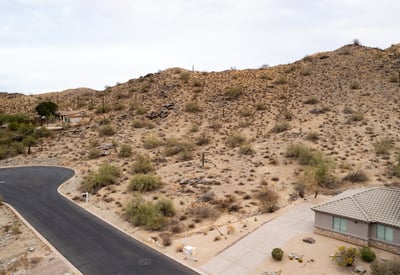 Expansive desert hillside lot offering panoramic mountain scenery and surrounding luxury homes. Located in Phoenix, this elevated property provides the ideal setting for a private custom retreat.