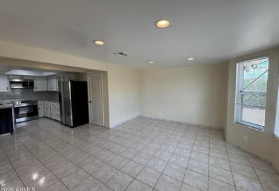 Spacious dining area adjacent to the updated kitchen with ample room for formal or casual dining. Natural light and an open layout enhance the home's flow and functionality.