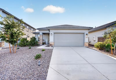 This beautifully maintained home welcomes you with contemporary architecture, a covered front porch, desert landscaping, a spacious driveway, and an attached two-car garage in the desirable Sunrise community of Surprise.