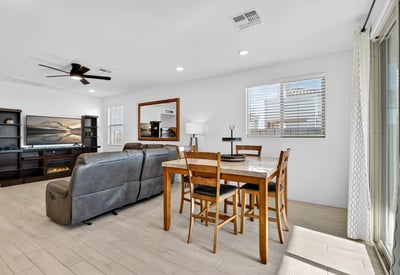 The dining area blends beautifully with the great room, offering an open-concept layout perfect for hosting guests while enjoying natural light and comfortable everyday living.