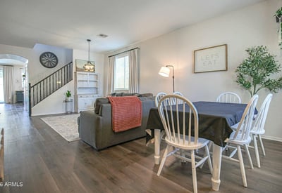 Bright dining area with seamless access to the living room and kitchen, offering an ideal setting for family meals, celebrations, and memorable gatherings in this move-in-ready Waddell home.