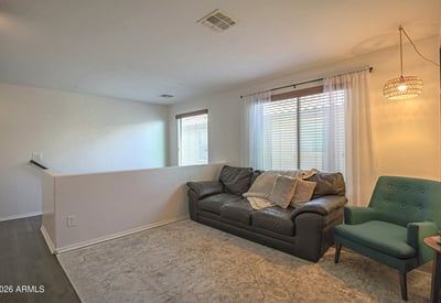 Open upstairs loft featuring updated flooring and flexible living space that's ideal for a home office, media room, homework station, or additional family lounge.
