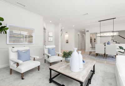 Family room featuring comfortable seating and a contemporary dining area, perfect for gatherings.