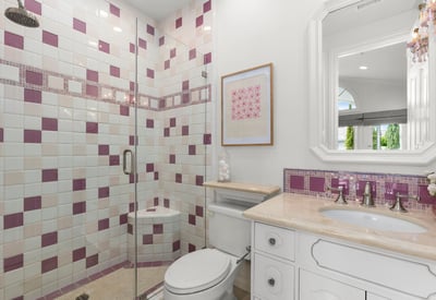 Bedroom 4-Private En-Suite Bath featuring a unique tile design, modern fixtures, and a spacious glass shower.