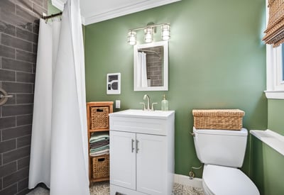 Chic bathroom with calming green hues.