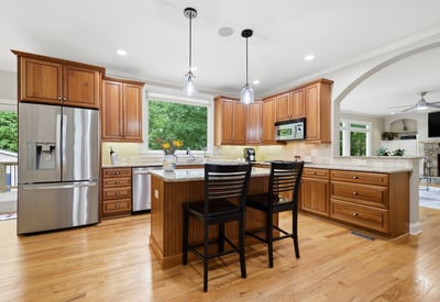 Spacious kitchen featuring custom cabinetry, modern fixtures, and an inviting island perfect for hosting gatherings.