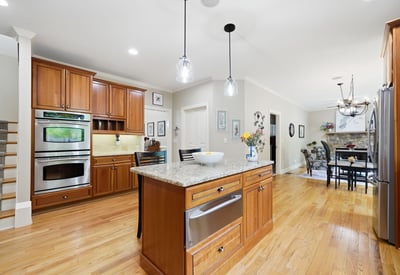 This modern kitchen features generous counter space, upscale appliances, and an inviting layout for gatherings.