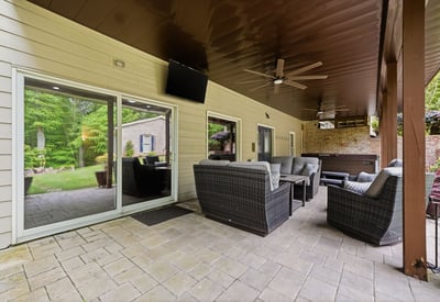 Discover a spacious outdoor patio area perfect for gatherings, complete with comfortable seating and serene views.