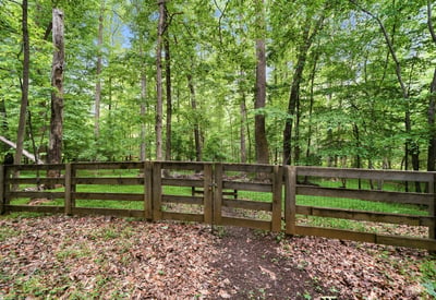 Explore this private wooded lot, ideal for creating your dream home amid nature's tranquility.
