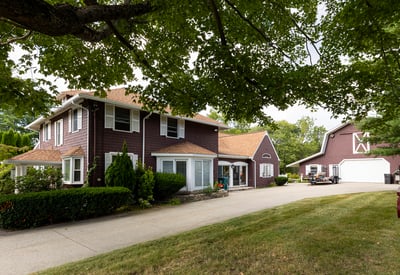 Spacious two-story home with modern amenities, a large yard, and a separate garage for ample storage.
