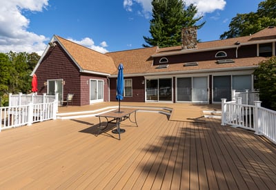 Spacious outdoor deck with shade umbrellas, perfect for entertaining and enjoying leisurely moments in nature.