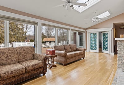 Bright and airy living space featuring large windows, abundant natural light, and direct access to outdoor areas.