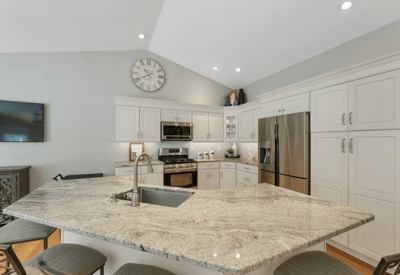 Bright and functional kitchen featuring modern appliances, a spacious island, and ample cabinetry for storage.