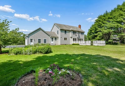 Spacious home featuring a large yard, perfect for outdoor activities and entertaining in a tranquil setting.
