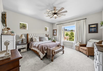 Primary Suite with attached 5 piece bath and walk in closet.
