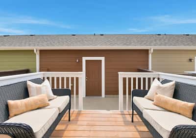 Enjoy private outdoor seating with a welcoming entrance, perfect for relaxed gatherings and quiet moments.