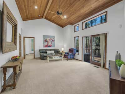 Open bonus living area with soaring ceilings, oversized windows, and endless possibilities for entertainment or relaxation. This inviting space enhances the home s spacious and functional floor plan.