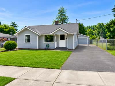 Bright single-story home with spacious yard and ample parking.
