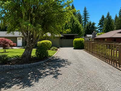 A view of the 2nd spacious driveway that leads to the carport with tons of storage.