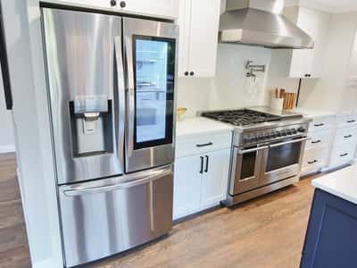 Modern kitchen featuring stainless steel appliances, ample storage, and a spacious layout for cooking and entertaining.